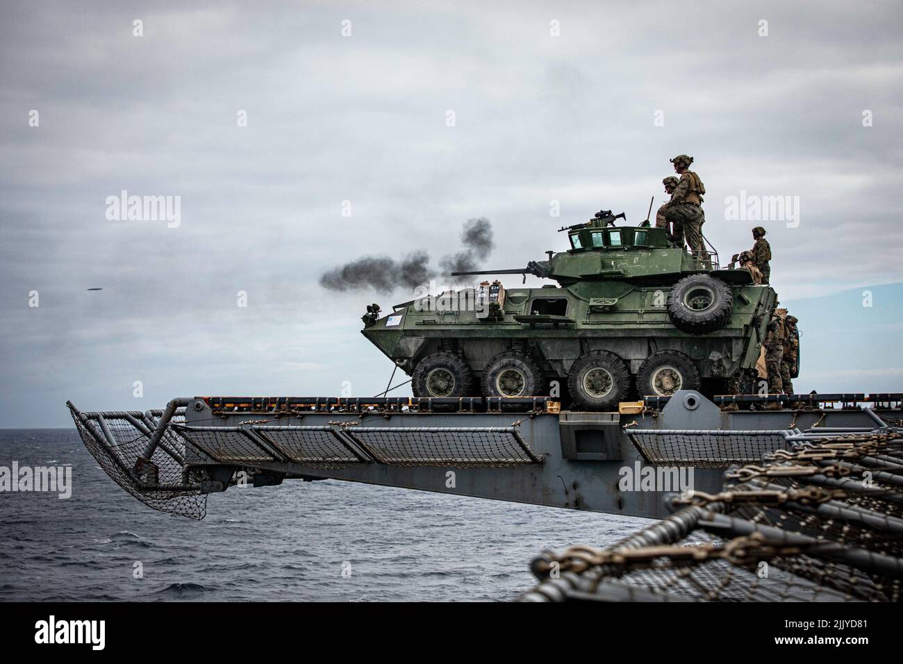 June 28, 2022 - At Sea - A U.S. Marine Corps light armored vehicle (LAV) A2-25 with Bravo Company, Ground Combat Element, 22nd Marine Expeditionary Unit (MEU), fires at targets during a live-fire exercise aboard the Wasp-class amphibious assault ship USS Kearsarge (LHD 3) in the Atlantic Ocean, June 28, 2022. The Kearsarge Amphibious Ready Group and embarked 22nd MEU, under the command and control of Task Force 61/2, is on a scheduled deployment in the U.S. Naval Forces Europe area of operations, employed by U.S. Sixth Fleet to defend U.S., allied and partner interests. (Credit Image: © U.S. M Stock Photo