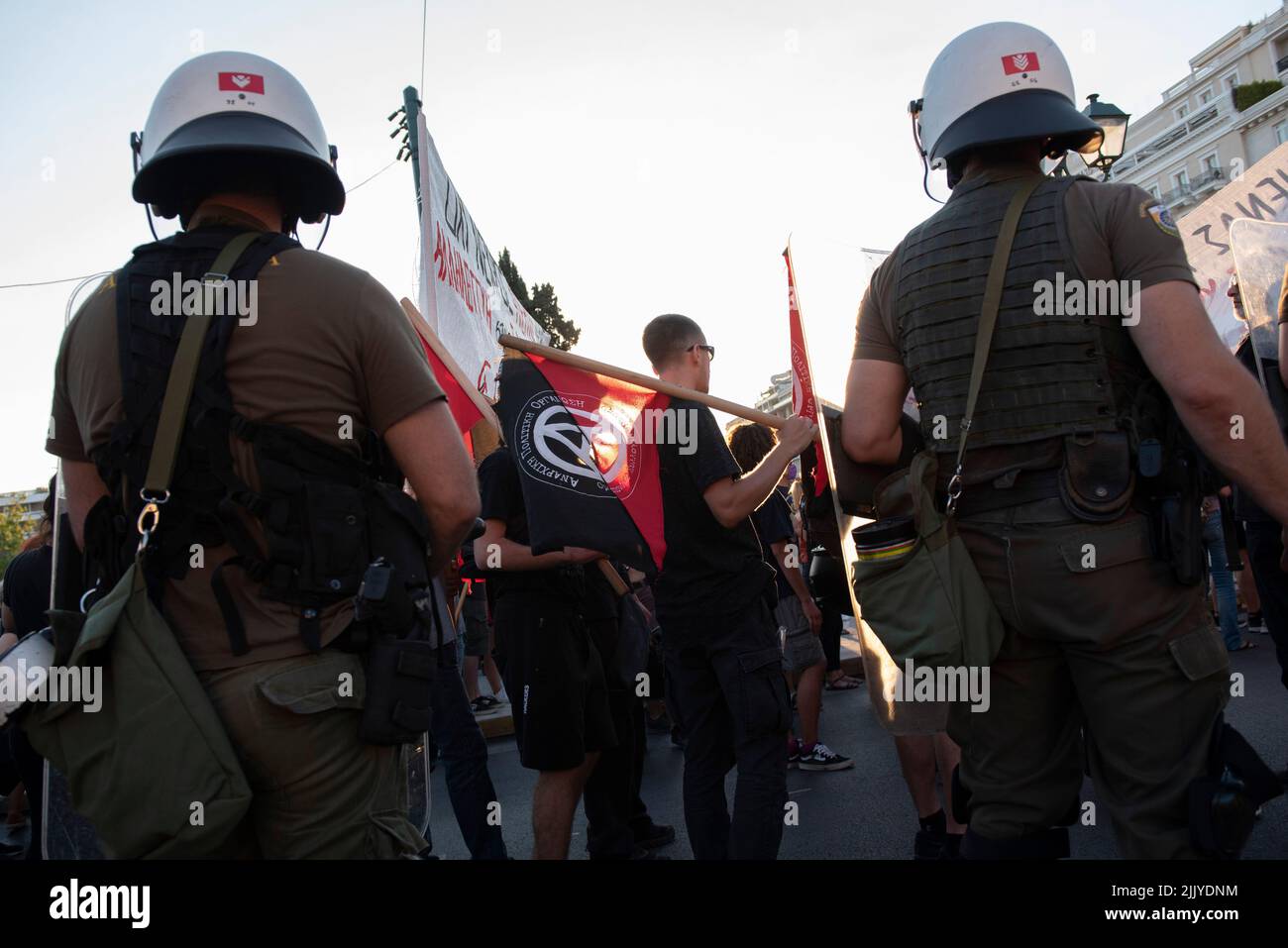 Athens, Greece. 28th July, 2022. Protesters try to run away from police tear gassing them and hitting them with batons and the water cannon. Thousands took to the streets to protest over the government's failure to deal with wildfires as well as show their solidarity with political prisoner Giannis Michailidis who has been on hunger strike since may 23rd. (Credit Image: © Nikolas Georgiou/ZUMA Press Wire) Stock Photo