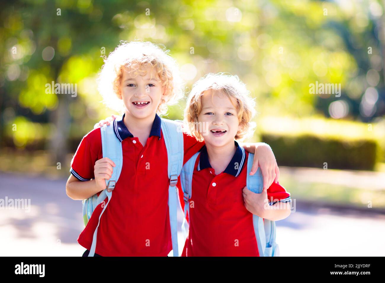 Children go back to school. Start of new school year after summer vacation. Boy and girl with