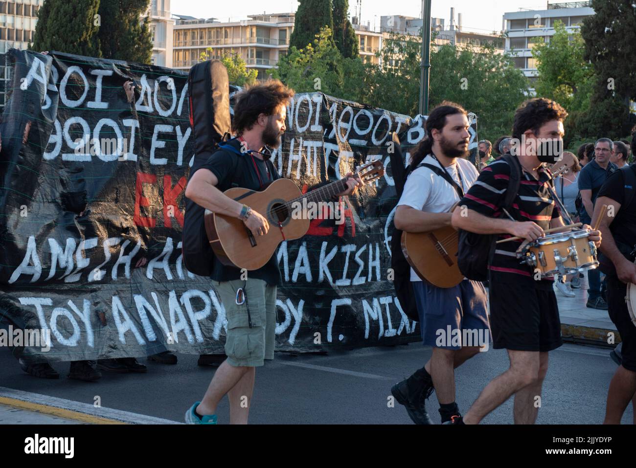 Athens, Greece. 28th July, 2022. Protesters try to run away from police tear gassing them and hitting them with batons and the water cannon. Thousands took to the streets to protest over the government's failure to deal with wildfires as well as show their solidarity with political prisoner Giannis Michailidis who has been on hunger strike since may 23rd. (Credit Image: © Nikolas Georgiou/ZUMA Press Wire) Stock Photo