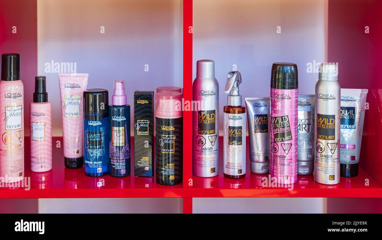 Modern beauty salon interior. Different cosmetics on shelves. Cosmetic section with conditioners, shampoo and hair treatment-July 20,2022-Victoria BC Stock Photo