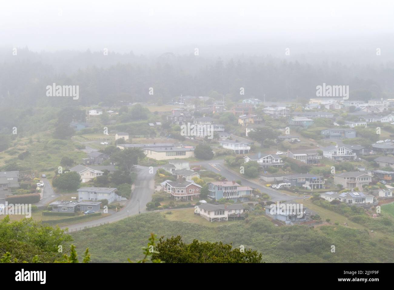 The town of Trinidad, Humboldt County, viewed from above, on a typical foggy day of Coastal Northern California Stock Photo