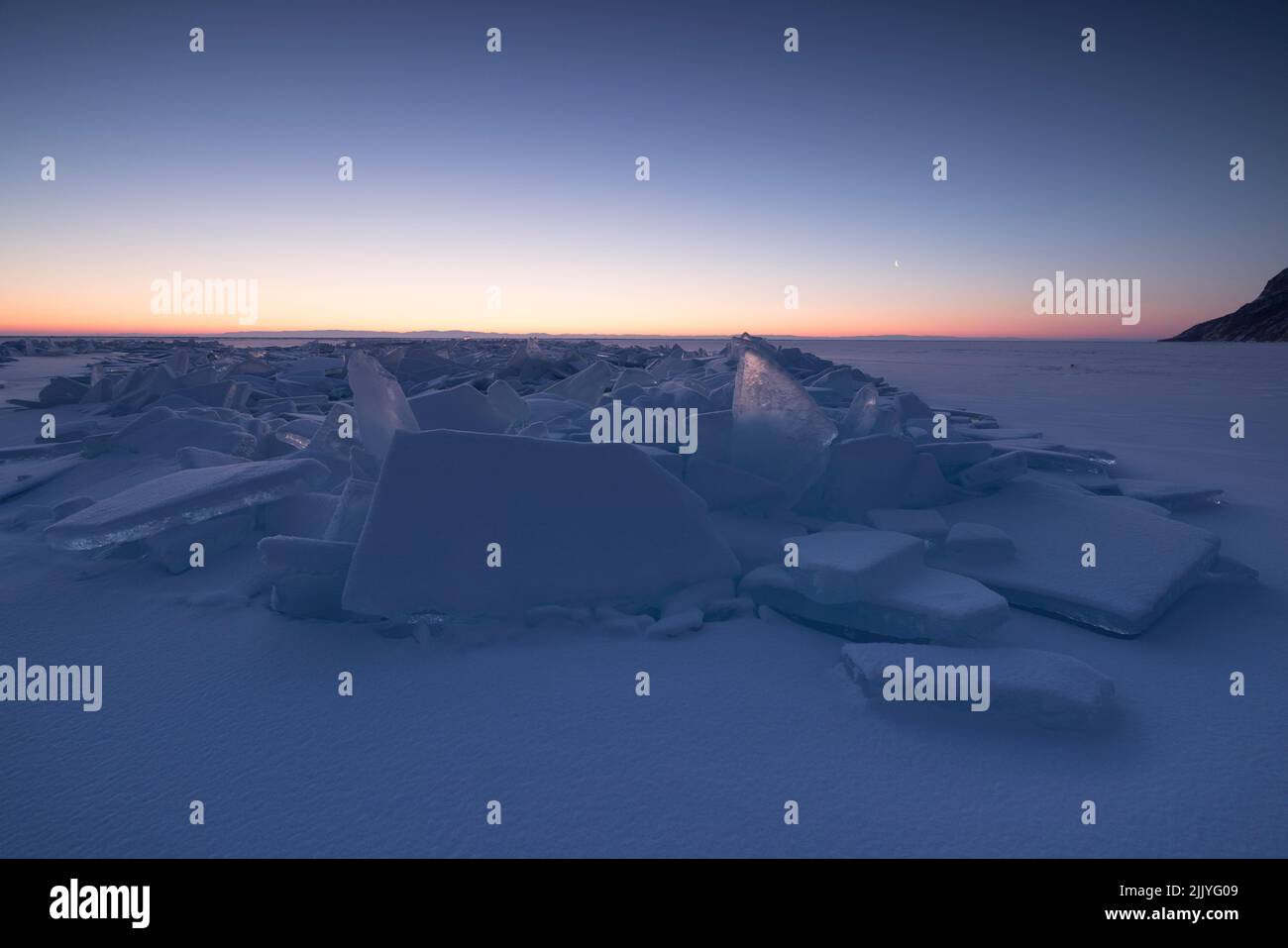 big ice blocks over frozen lake Stock Photo Alamy
