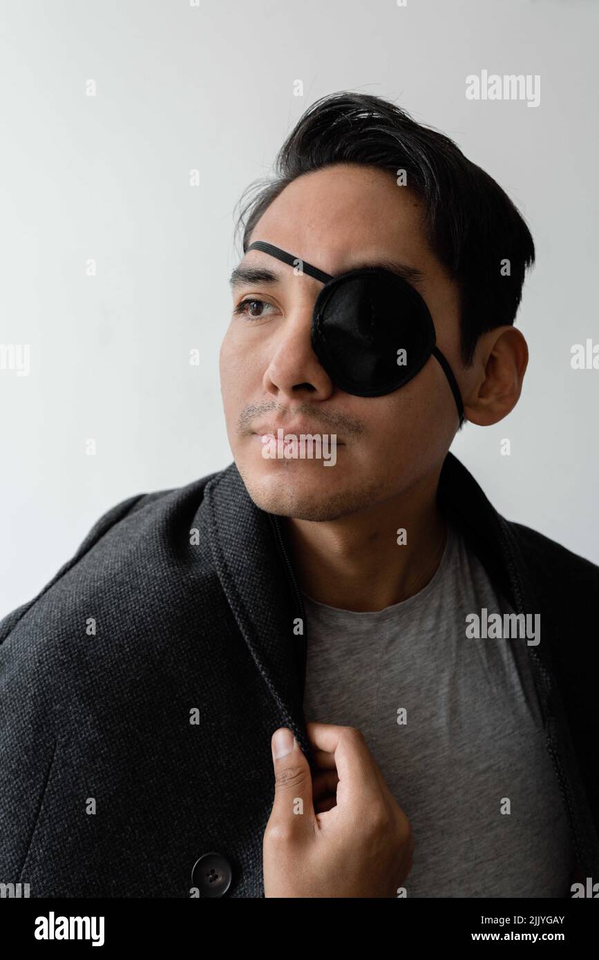 Man wearing an eye patch Stock Photo