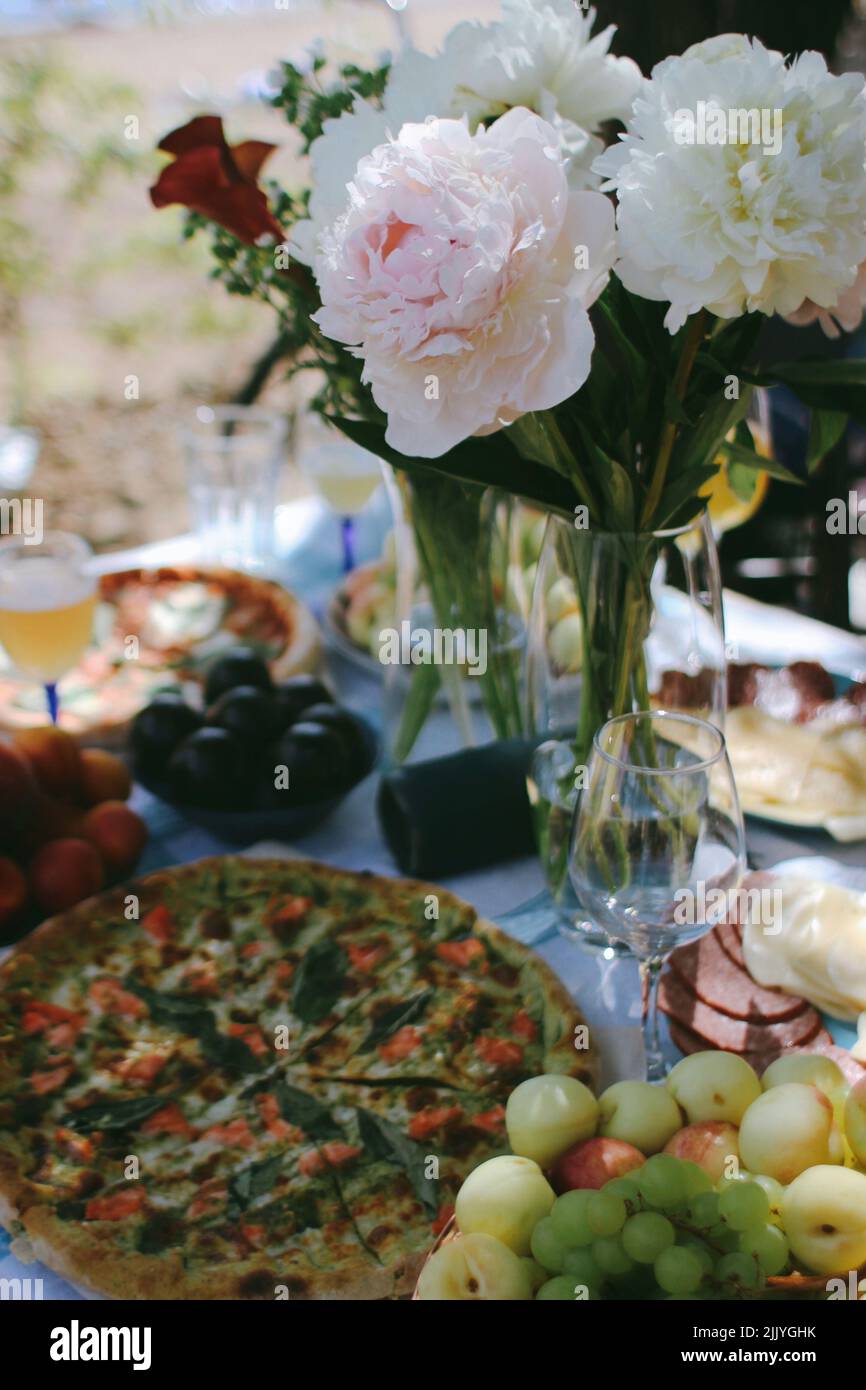 picnic with flowers and pizza Stock Photo Alamy