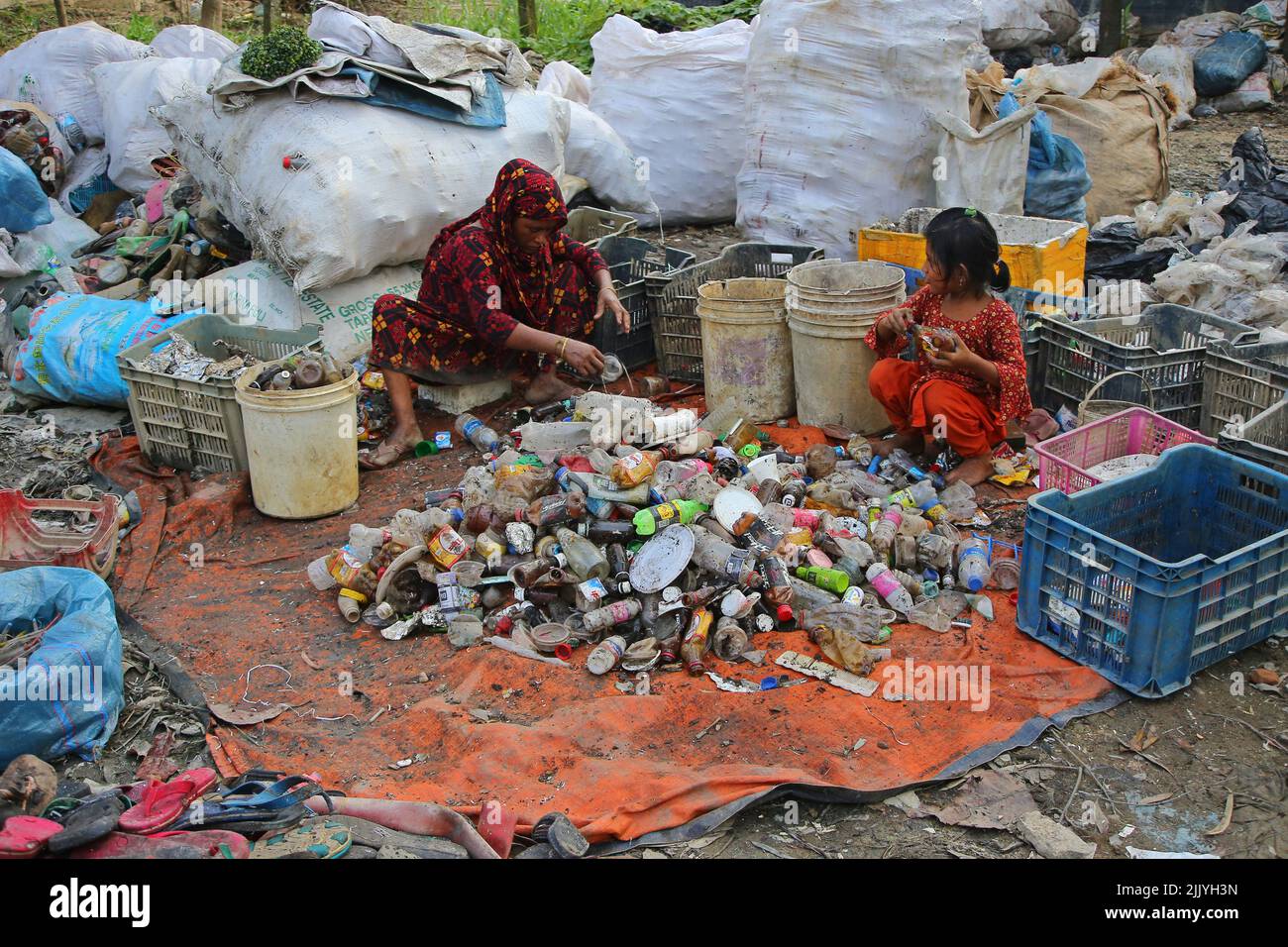 Sylhet, Mexico City, Bangladesh. 27th July, 2022. July 27, 2022, Sylhet, Bangladesh. Workers are working in plastic recycling factories with health risks without adequate safety. Where there is plastic clinical waste which is harmful to health. on July 27, 2022, Sylhet, Bangladesh. (Credit Image: © H M Shahidul Islam/eyepix via ZUMA Press Wire) Stock Photo