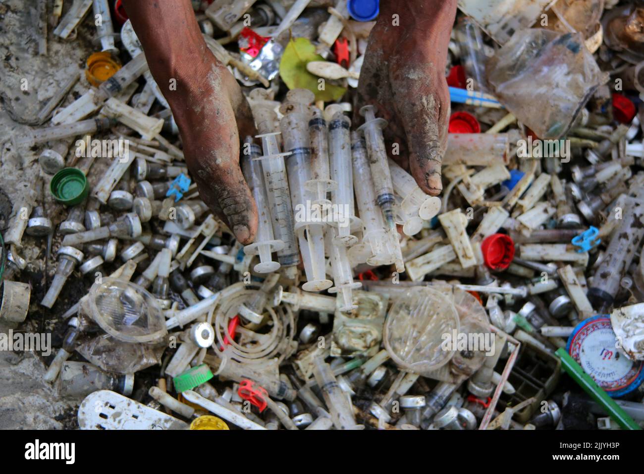 Sylhet, Mexico City, Bangladesh. 27th July, 2022. July 27, 2022, Sylhet, Bangladesh. Workers are working in plastic recycling factories with health risks without adequate safety. Where there is plastic clinical waste which is harmful to health. on July 27, 2022, Sylhet, Bangladesh. (Credit Image: © H M Shahidul Islam/eyepix via ZUMA Press Wire) Stock Photo