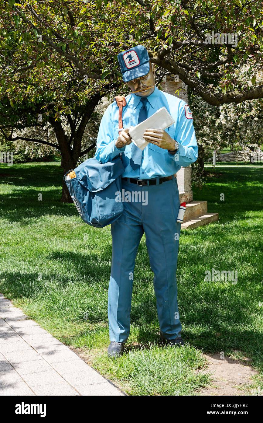 Mailman statue, blue uniform, bag, lifelike, by Seward Johnson, Grounds for Sculpture; Seward Johnson Center for the Arts, New Jersey; Hamilton; NJ Stock Photo