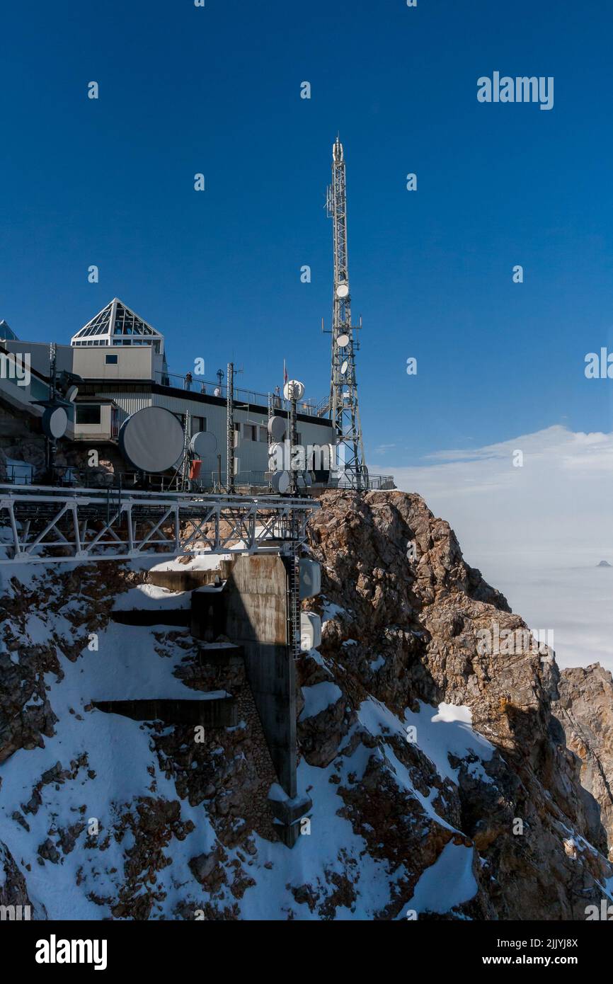 Powerful Radio Antennas at Research Centre on top Zugspitze Mountains. Telecommunications Antennas with Radar and receivers on different Frequencies Stock Photo