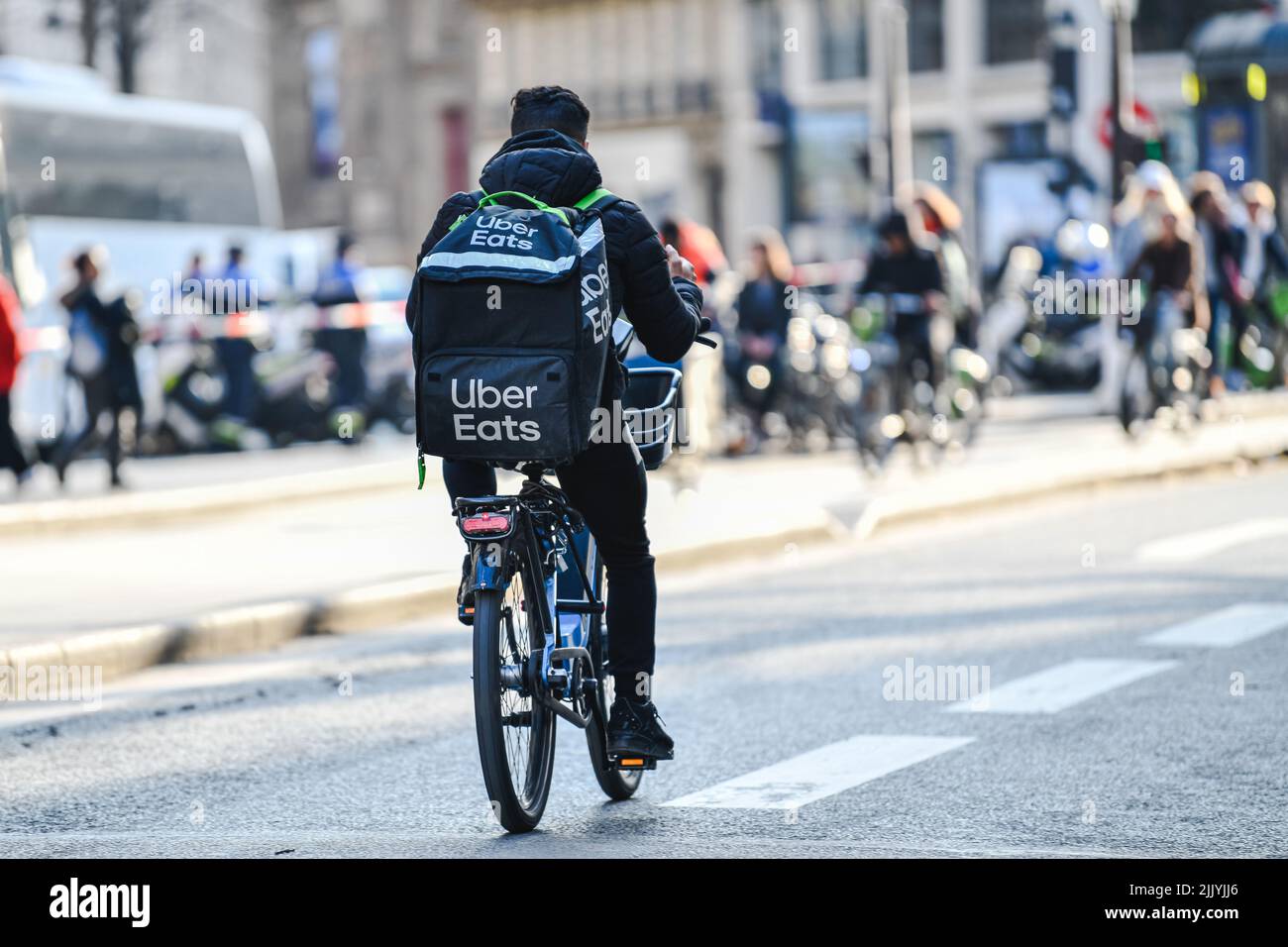 A deliver for Uber Eats on his bike (bicyle). Illustration of delivers