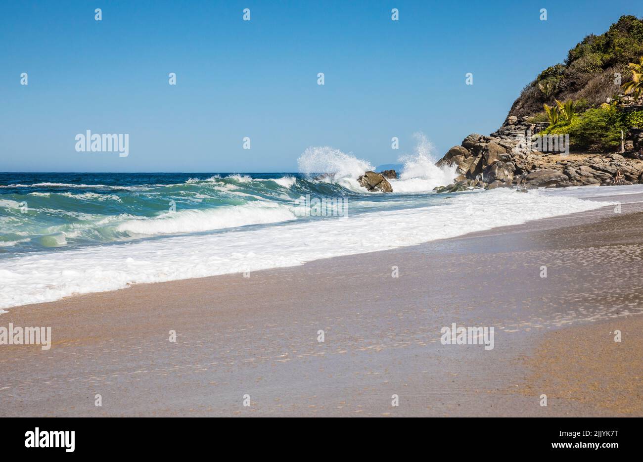 Waves crashing on the rocks at the North end of Playa Sayulita, Sayulita, Nayarit, Mexico. Stock Photo