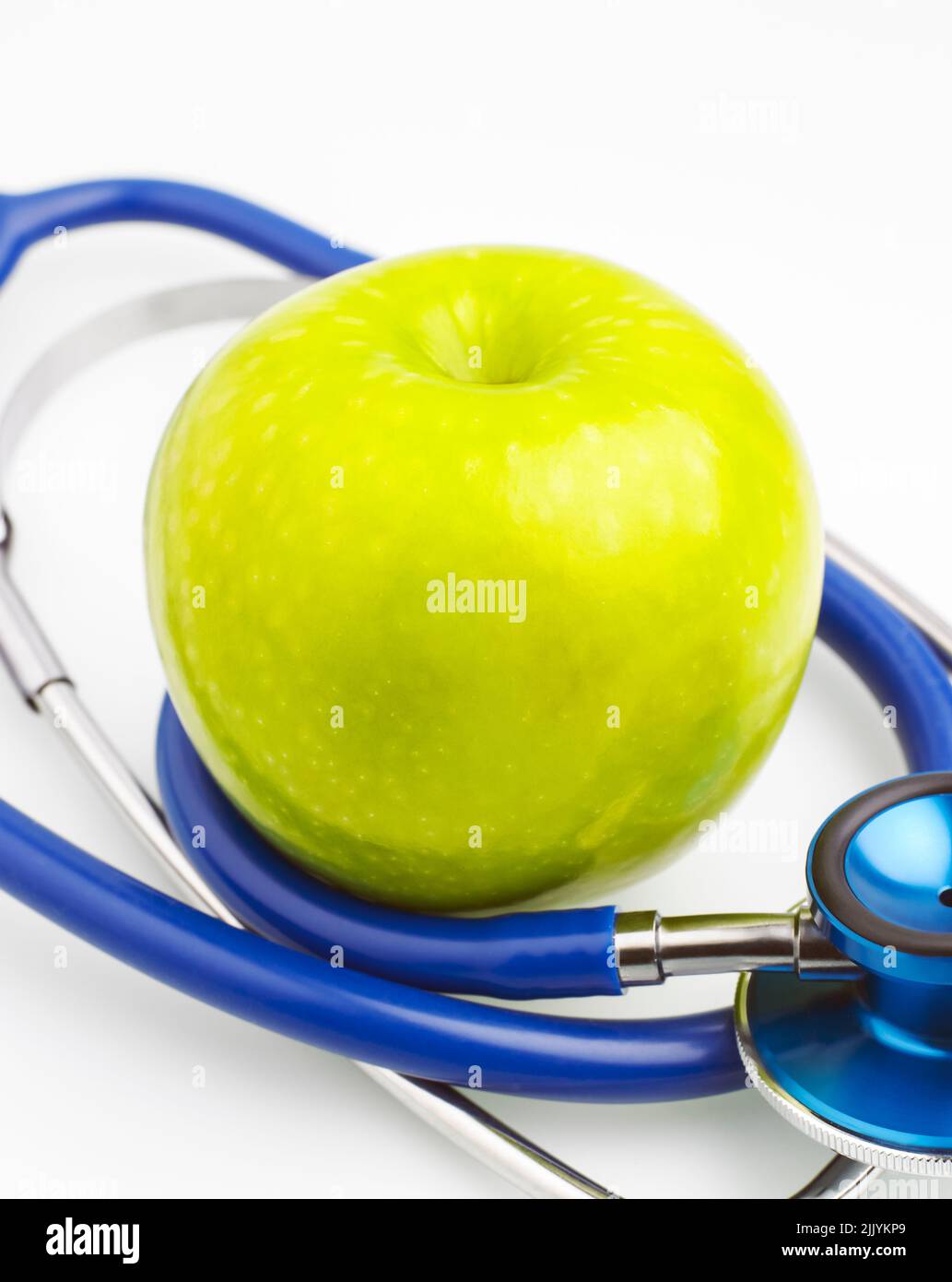 Green apple and stethoscope on white background Stock Photo