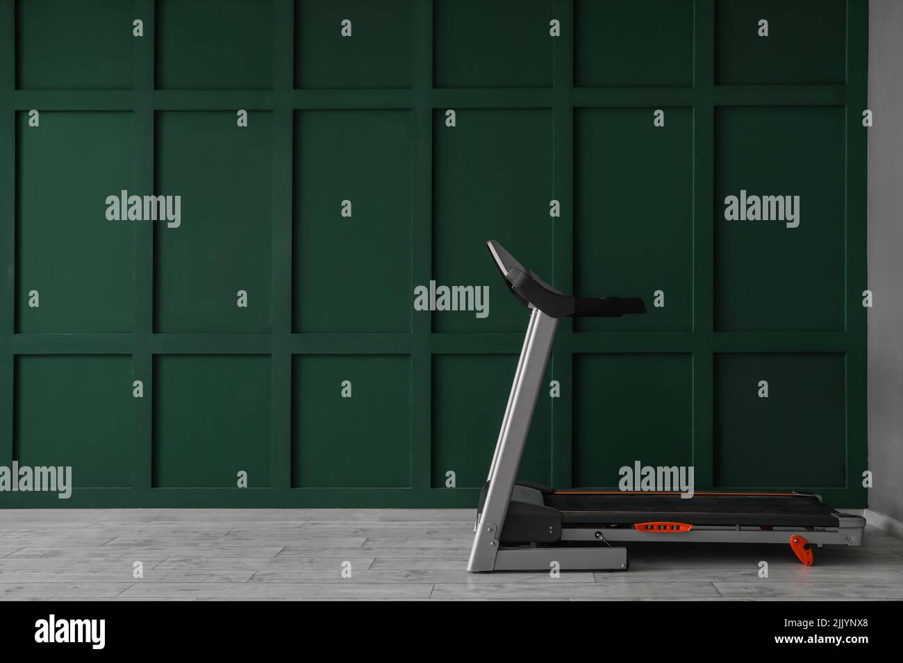 Modern treadmill near green wall Stock Photo Alamy Modern treadmill near green wall Stock Photo Alamy