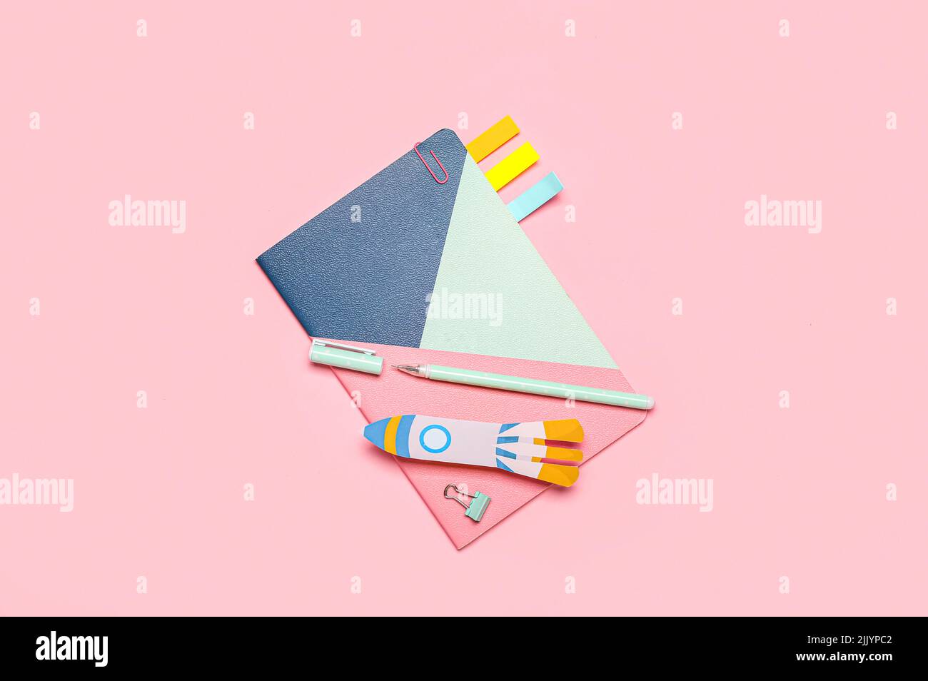 Paper Rockets Pink Paper rocket with school stationery on pink background Stock Photo - Alamy