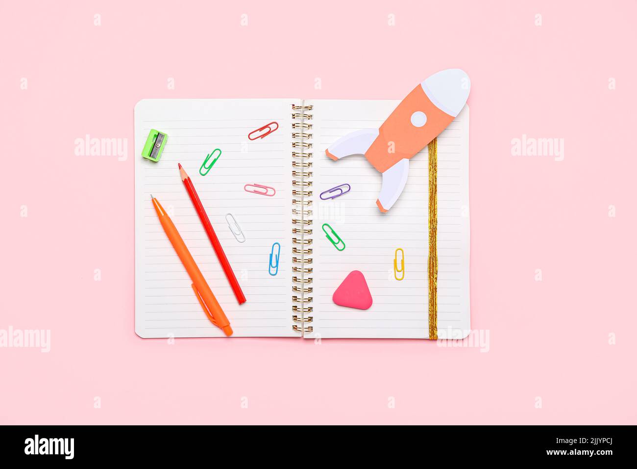 Paper Rockets Pink Paper rocket with school stationery on pink background Stock Photo - Alamy