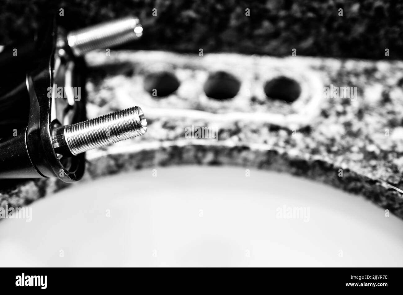 Replacing a bathroom sink faucet with a new assembly Stock Photo Alamy
