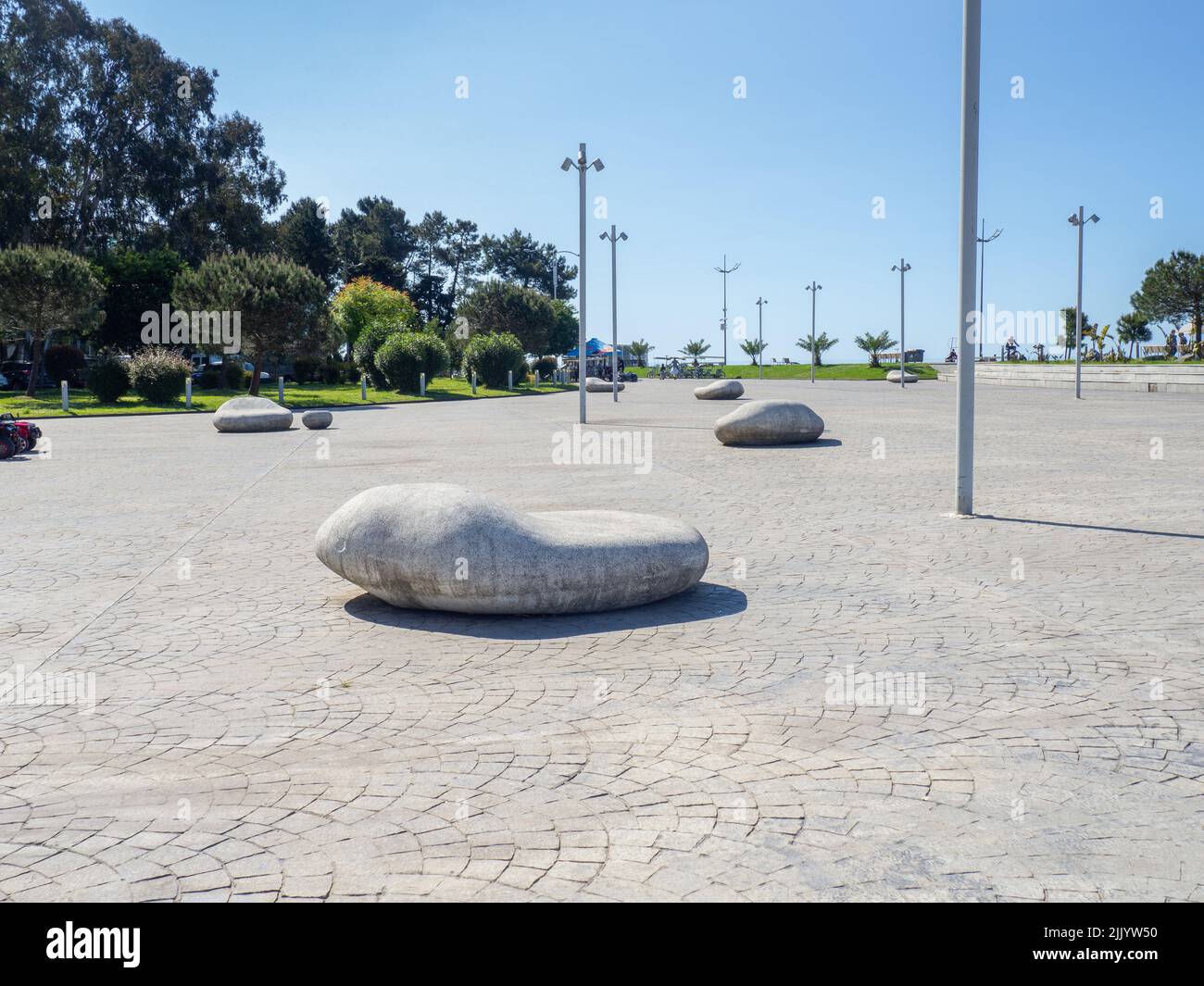 Design of unusual stone benches. Unusually shaped benches in the park