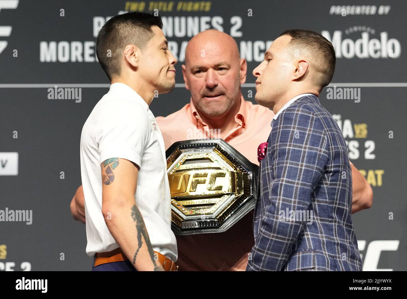 Dallas, Texas, United States. 28th July, 2022. DALLAS, TX - July 28: Brandon Moreno (L) and Kai Kara-France (R) face-off at American Airlines Center for UFC 277 - Peña vs Nunes 2 : Press Conference on July 28, 2022 in Dallas, Texas, United States. (Photo by Louis Grasse/PxImages) Credit: Px Images/Alamy Live News Stock Photo