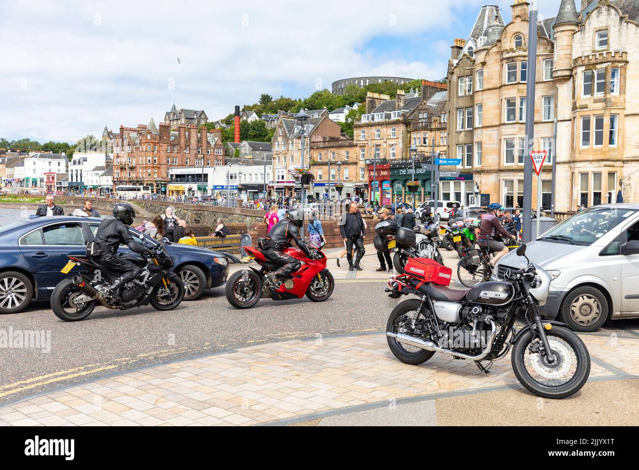 Oban west coast of Scotland, motorcyclists and motorbikes in a tour group meet in Oban town centre, summer 2022,Scotland,United Kingdom Stock Photo