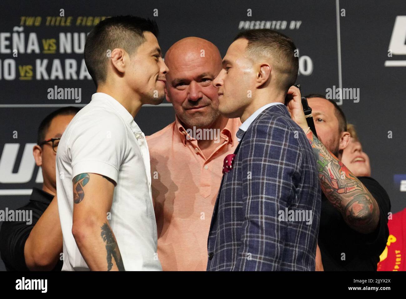 Dallas, Texas, United States. 28th July, 2022. DALLAS, TX - July 28: Brandon Moreno (L) and Kai Kara-France (R) face-off for the press with fans in attendance at American Airlines Center for UFC 277 - Peña vs Nunes 2 : Press Conference on July 28, 2022 in Dallas, Texas, United States. (Photo by Louis Grasse/PxImages) Credit: Px Images/Alamy Live News Stock Photo
