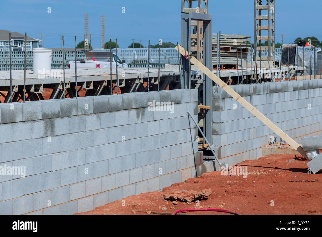 Building scaffolding to mount concrete blocks for the purpose of mounting walls Stock Photo Alamy