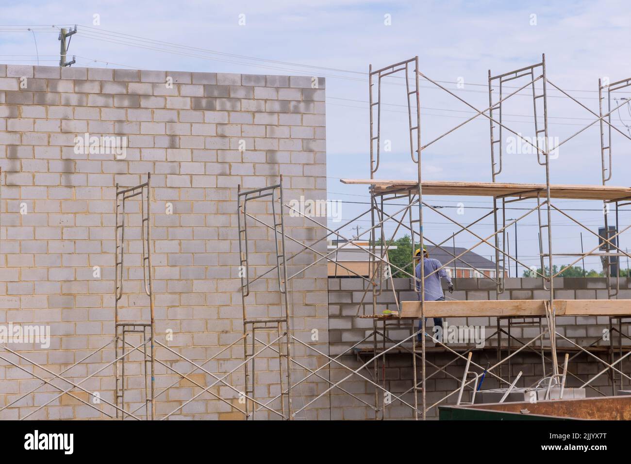 Scaffolding was used to mount blocks of concrete on the walls of the