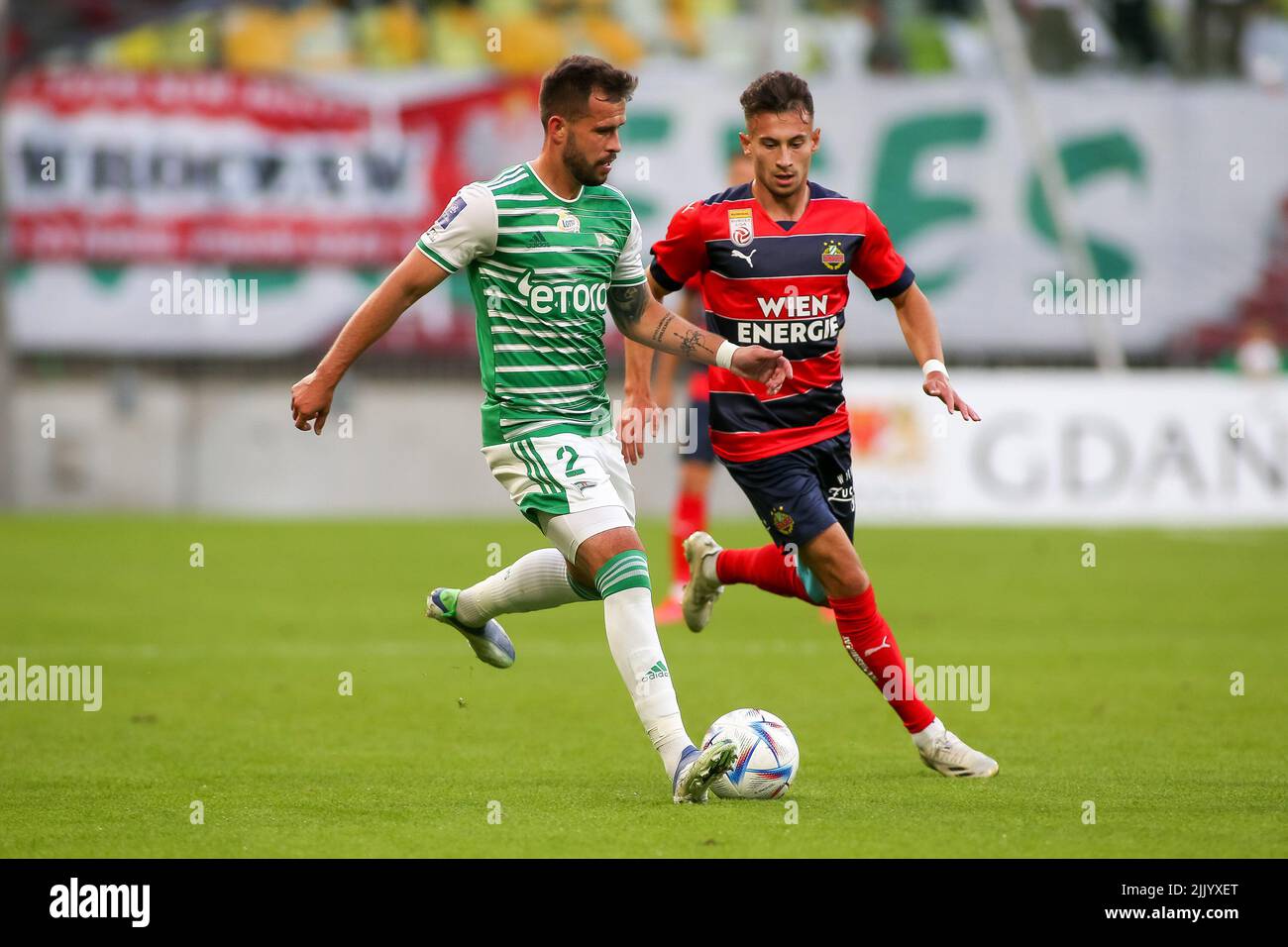 Gdansk, Poland. 28th July, 2022. Rafal Pietrzak (L) of Lechia Gdansk and Nicolas Kuhn (R) of Rapid Vienna are seen in action during the UEFA Europa Conference League match between Lecha Gdansk and SK Rapid Vienna in Gdansk. (Final score; Lechia Gdansk 1:2 SK Rapid Vienna) (Photo by Tomasz Zasinski/SOPA Images/Sipa USA) Credit: Sipa USA/Alamy Live News Stock Photo