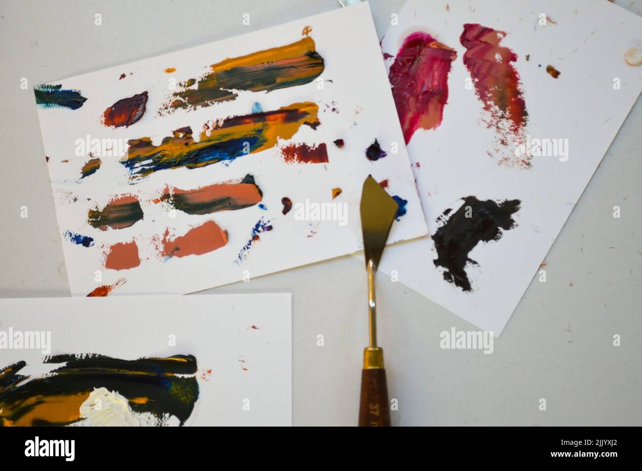 painting with spatula on blank canvases, with oil paints Stock Photo