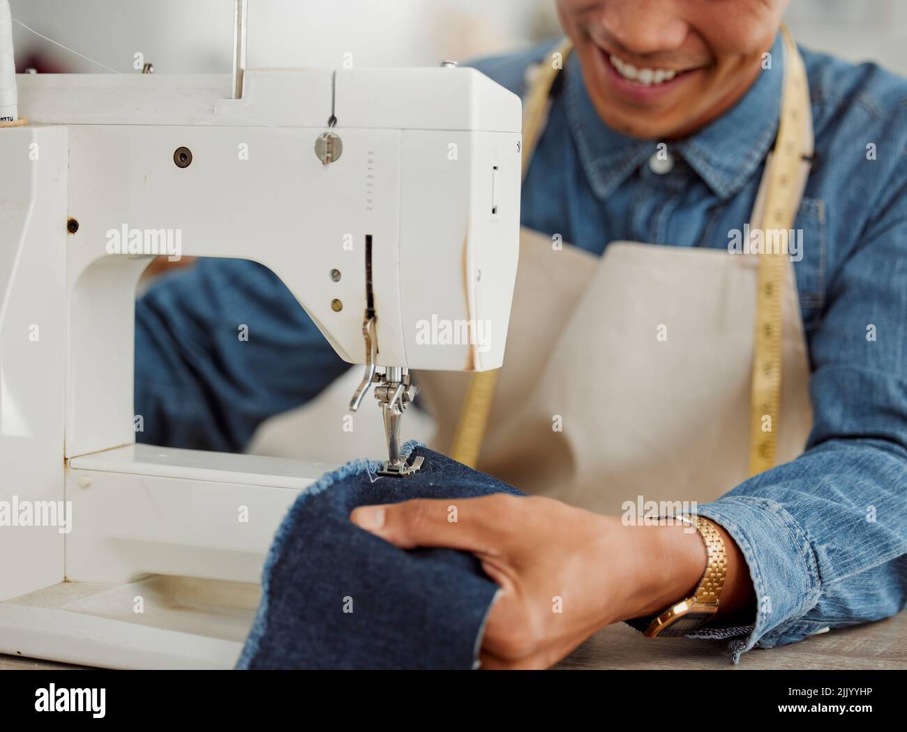 Design student, creative and worker in a studio sewing clothes and