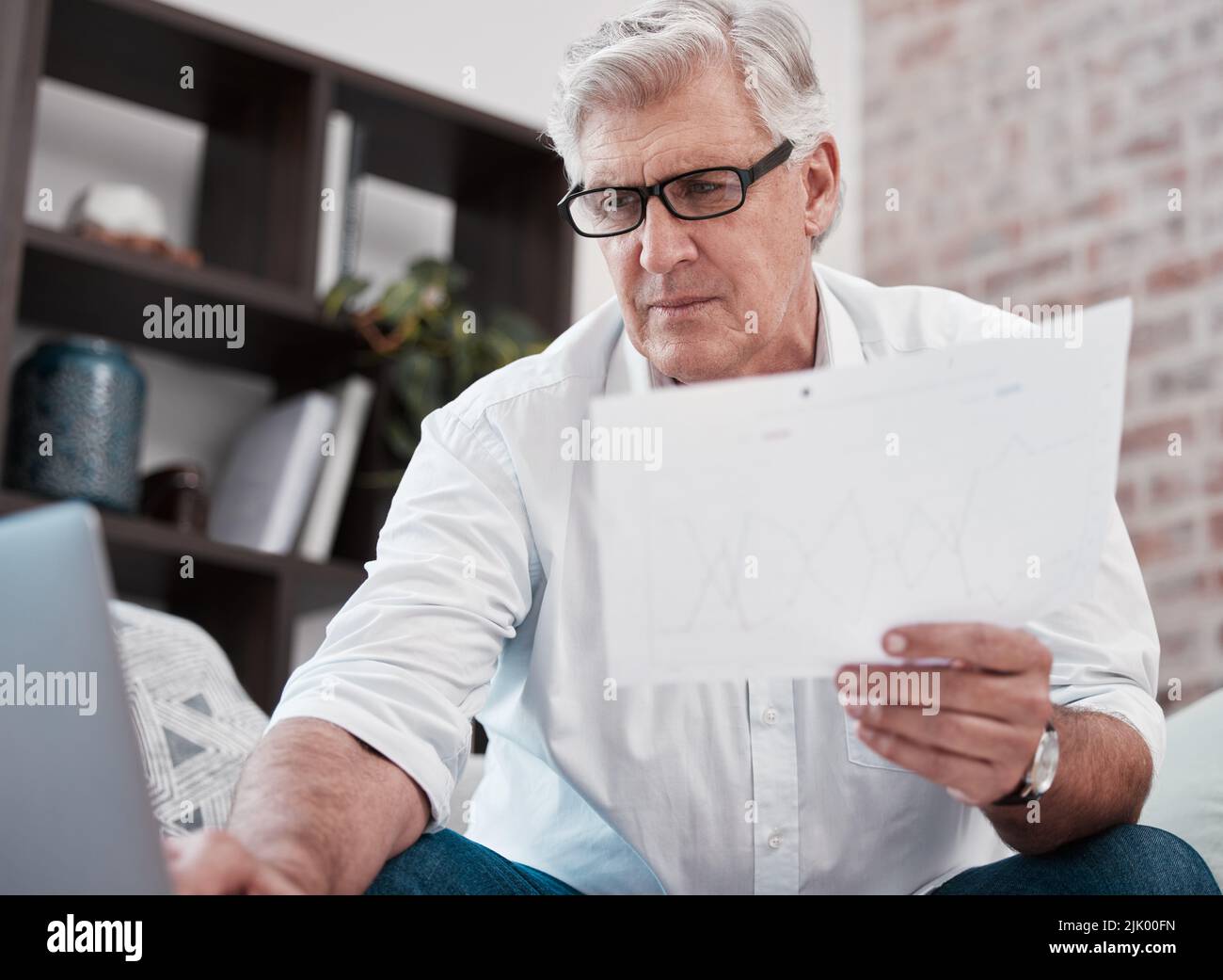 Where did those come from. a mature man checking some paperwork on the
