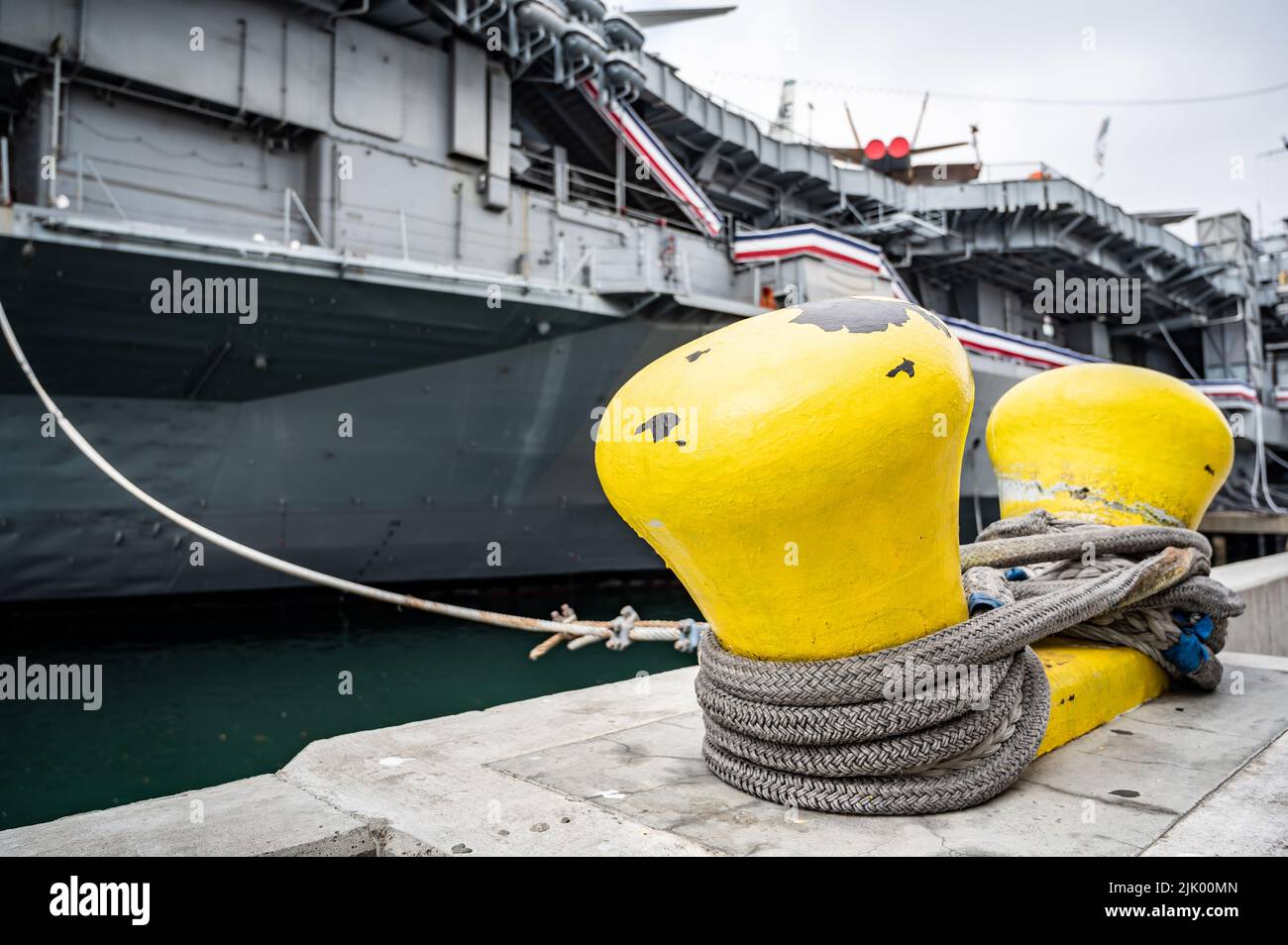 Selective focus on line securing a naval boat to a port bollard Stock ...