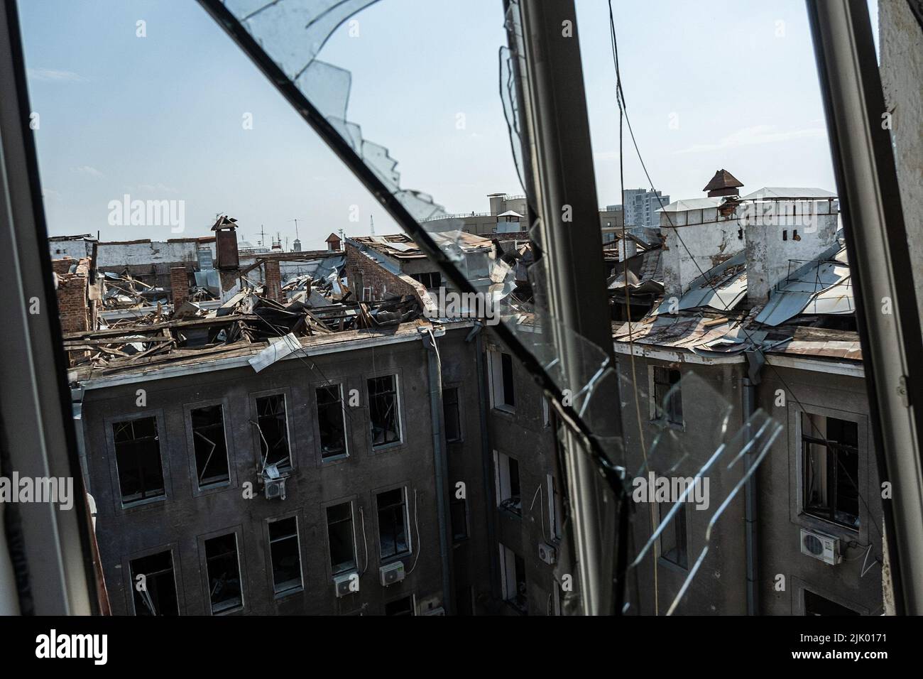 Destroyed rooftops of buildings seen from the office of a communist ...