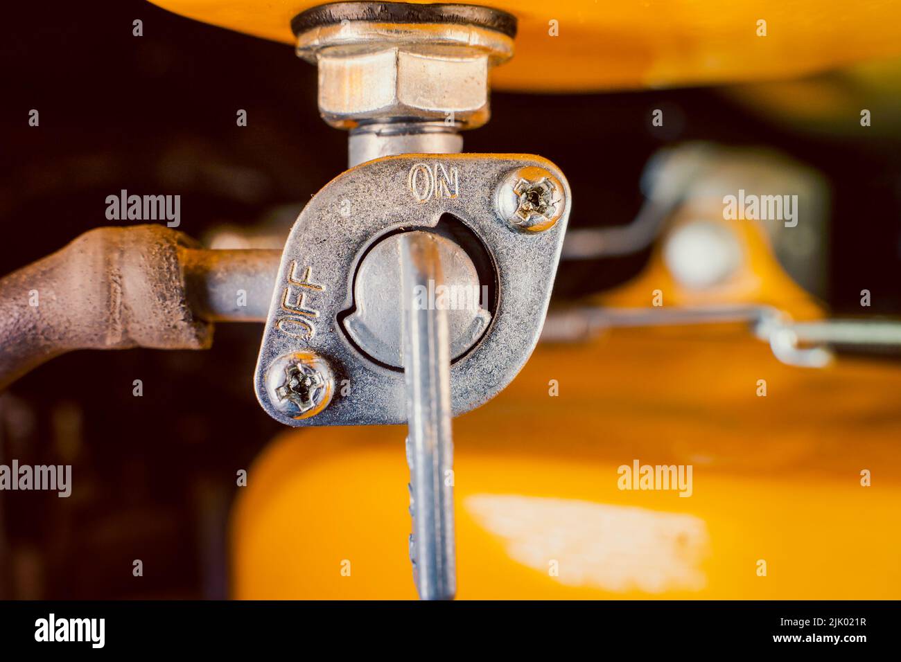Fuel valve of a gasoline generator close-up with an open fuel supply Stock Photo