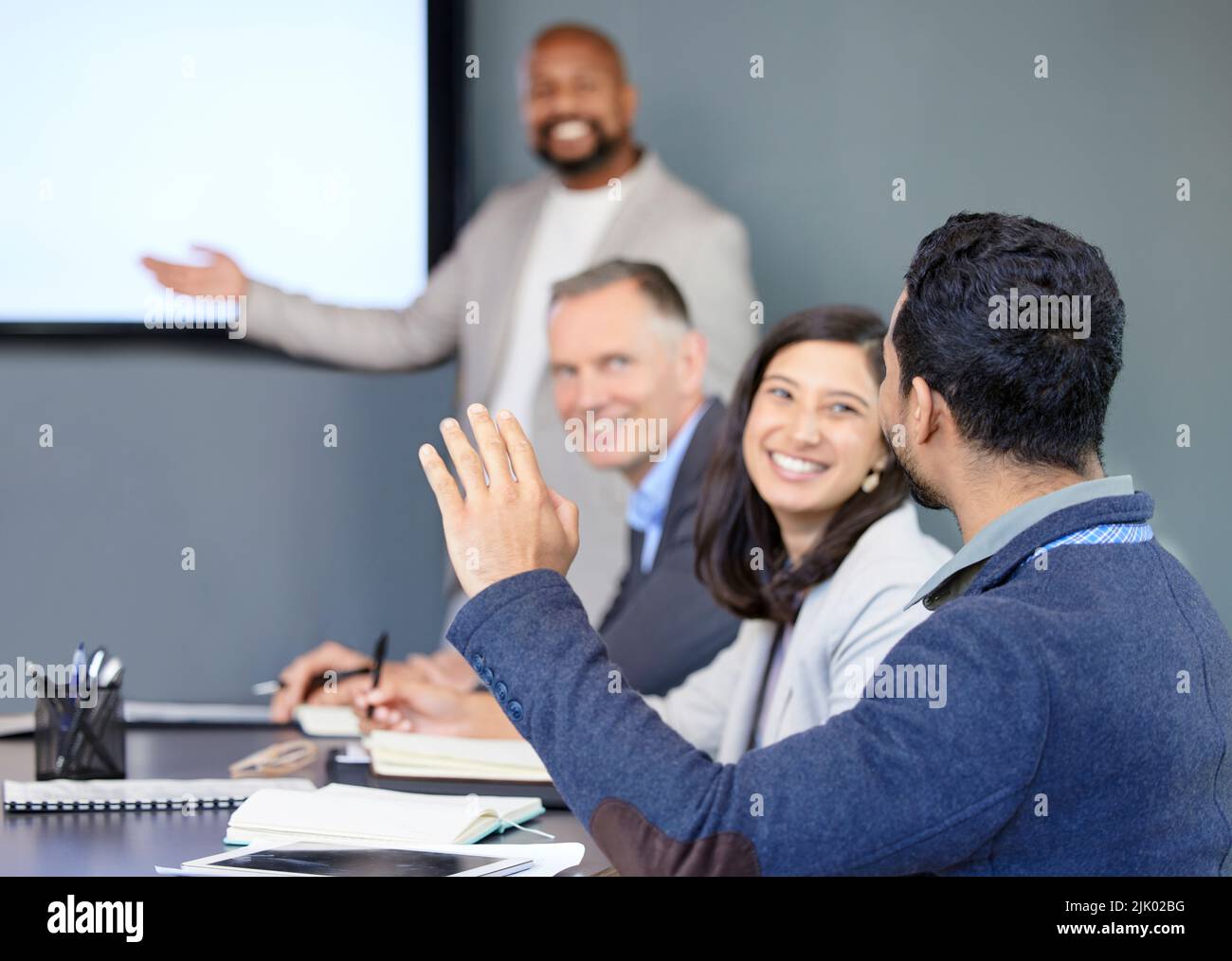 People raising hand office behind hi-res stock photography and images ...