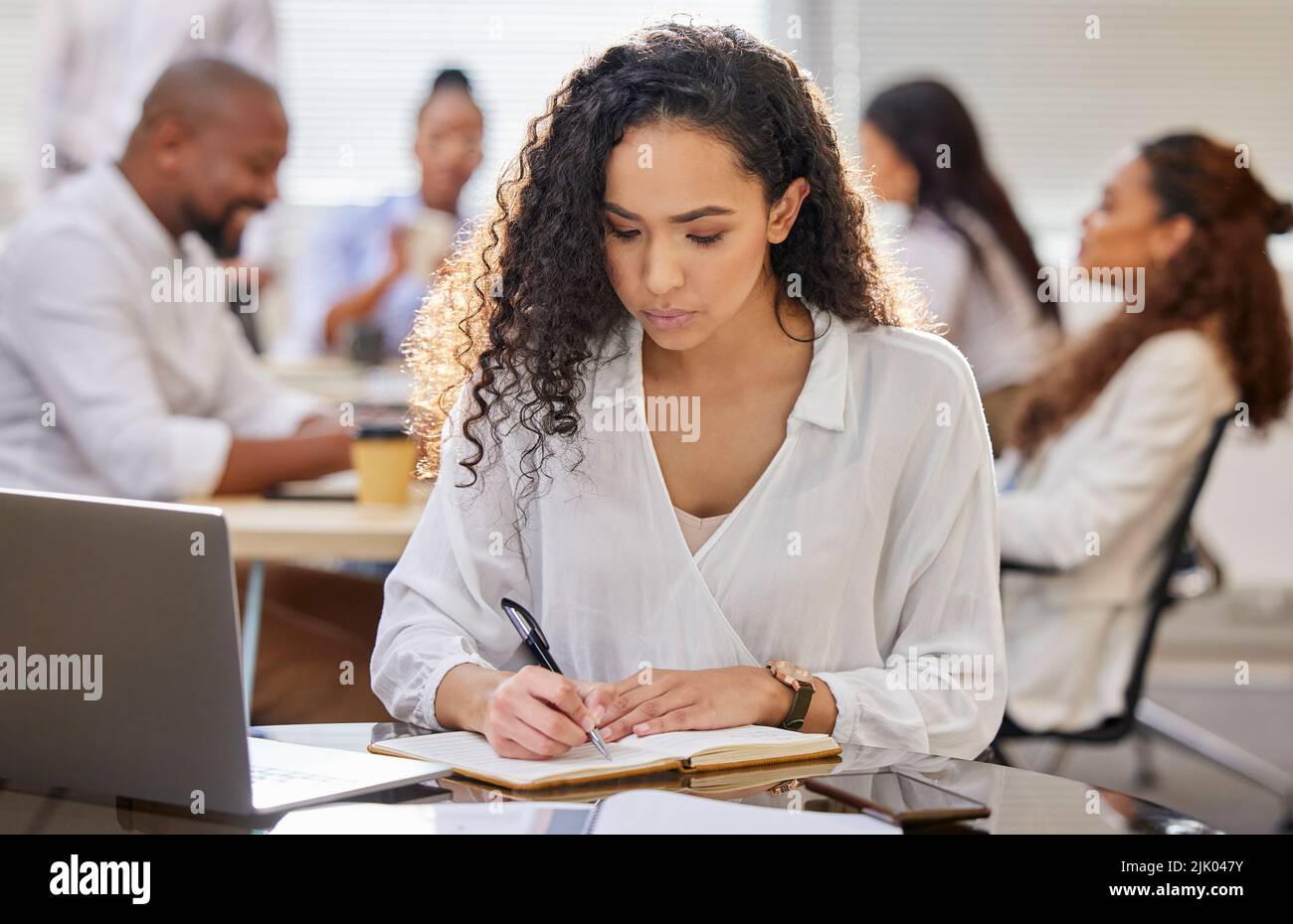 Businesspeople sitting taking notes woman hi-res stock photography and ...
