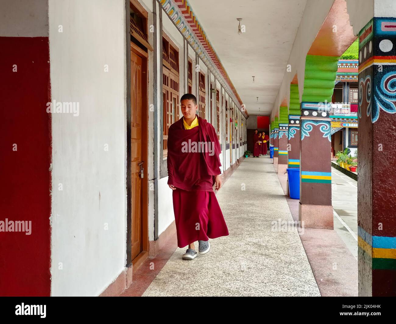 17 June 2022, Gangtok, Sikkim, monk walking in Ranka (Lingdum or Pal Zurmang Kagyud), Golden Temple, Monastery in Gangtok. Stock Photo