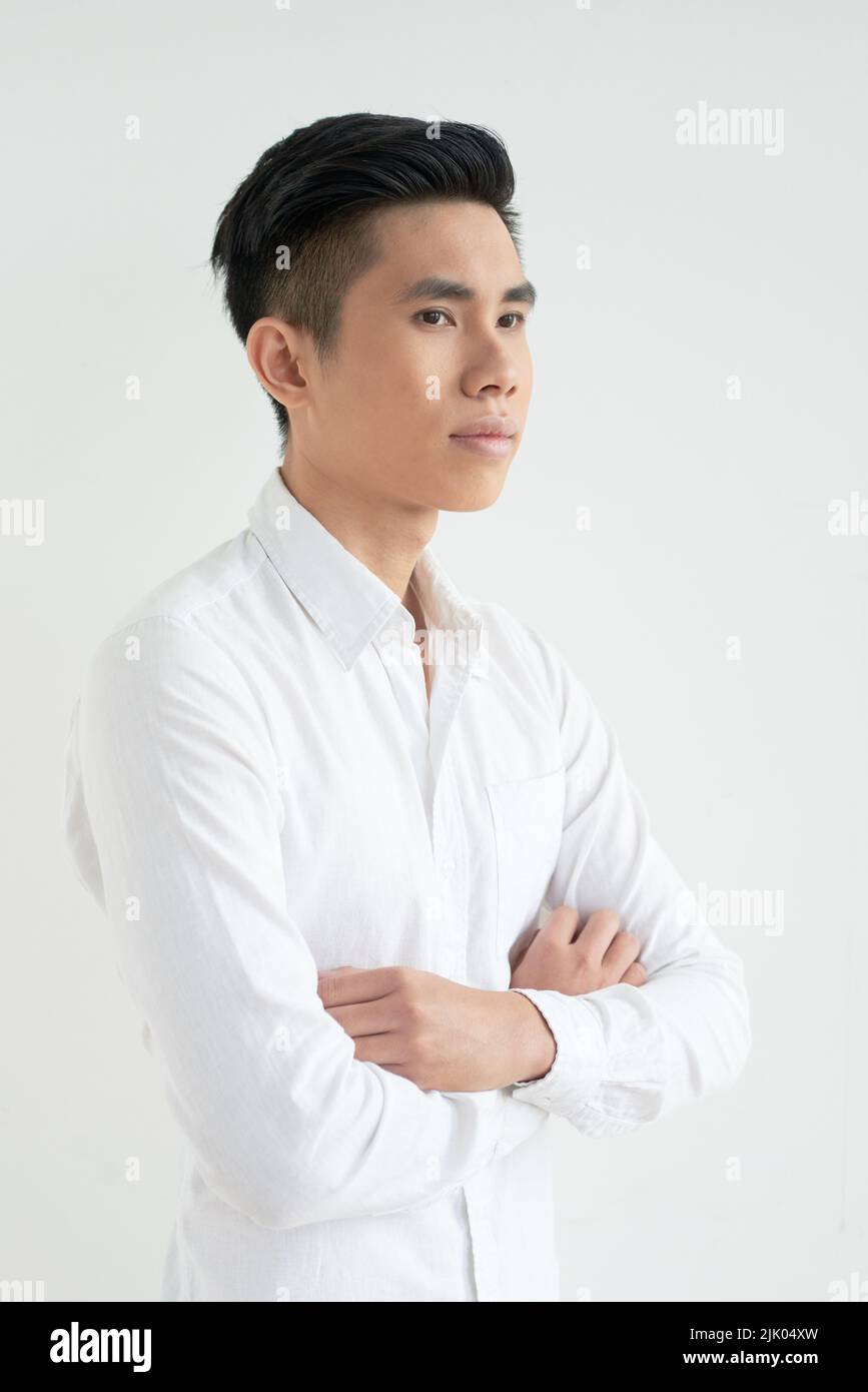 portrait-of-handsome-vietnamese-young-man-standing-with-his-arms-folded