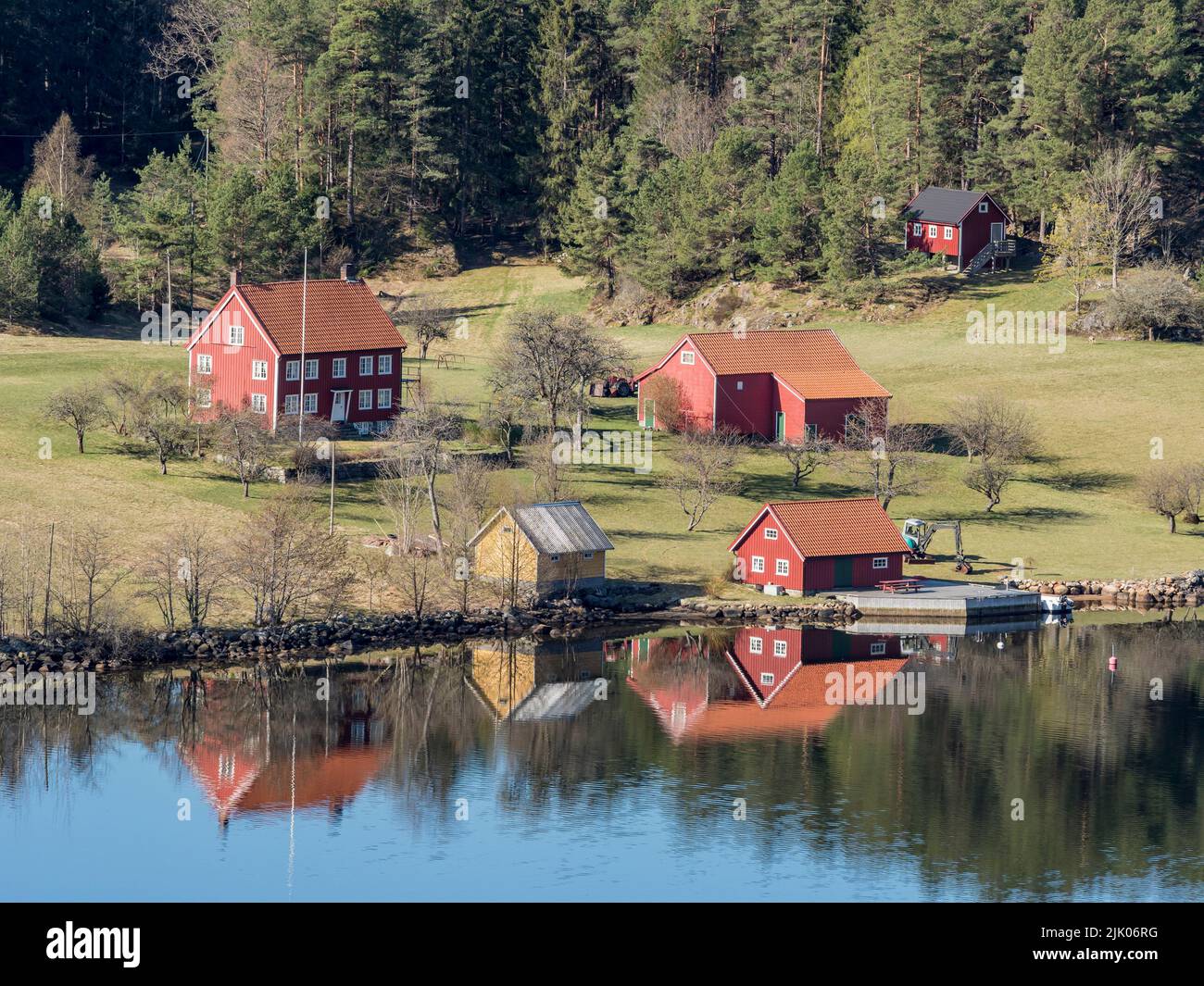 Farm with red houses on an island near Risor, norwegean southern coast, Norway Stock Photo