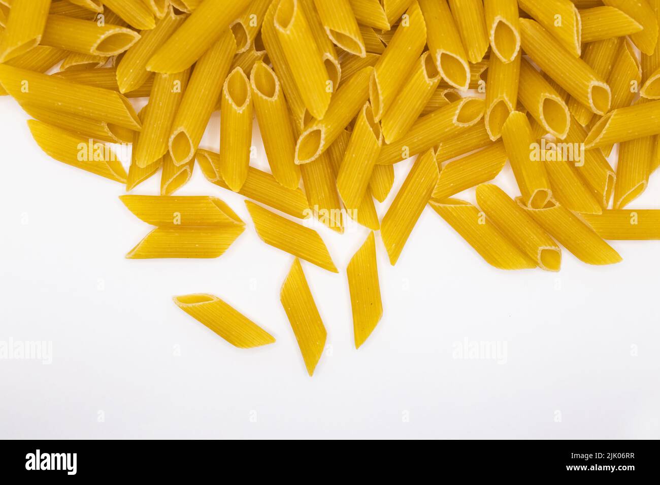 shallow depth of field dried itallian small spiral rotini pasta on a white background Stock Photo