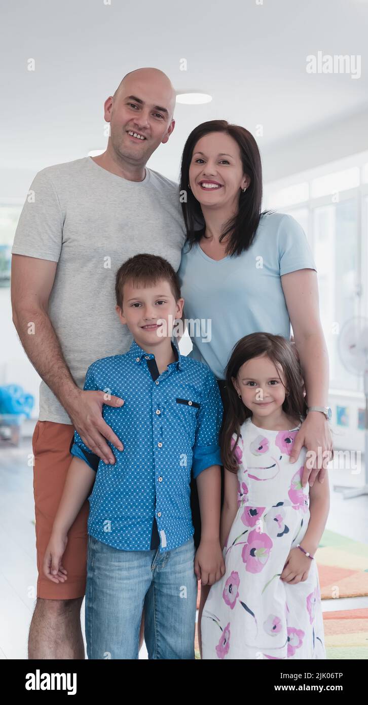 Portrait of a happy family. Photo of parents with children in a modern ...