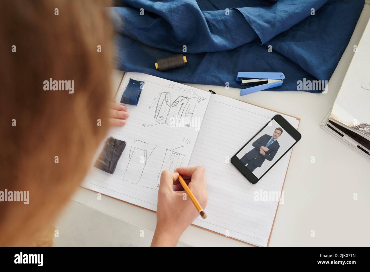 Fashion designer drawing models for new collection Stock Photo