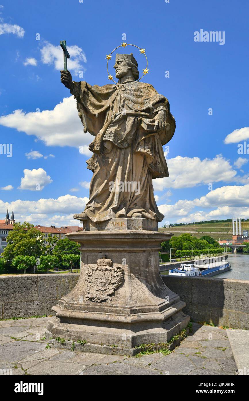 Würzburg, Germany - June 2022: Sculpture of saint of John of Nepomuk at famous old Main bridge called 'Alte Mainbrücke' Stock Photo