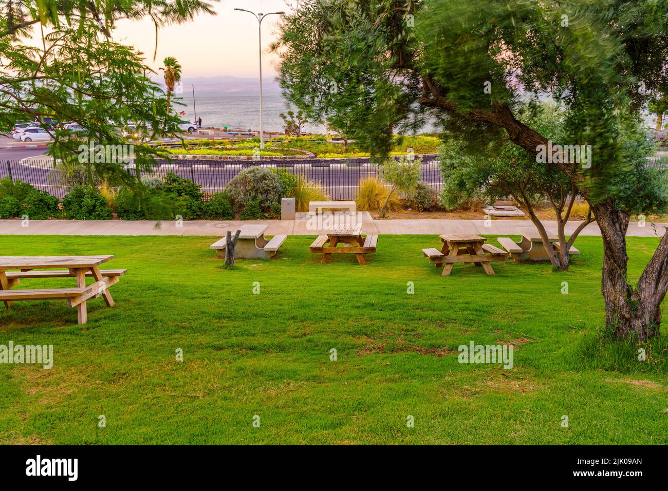 View of a picnic area, and the Sea of Galilee, in Hamat Tiberias National Park, Northern Israel Stock Photo