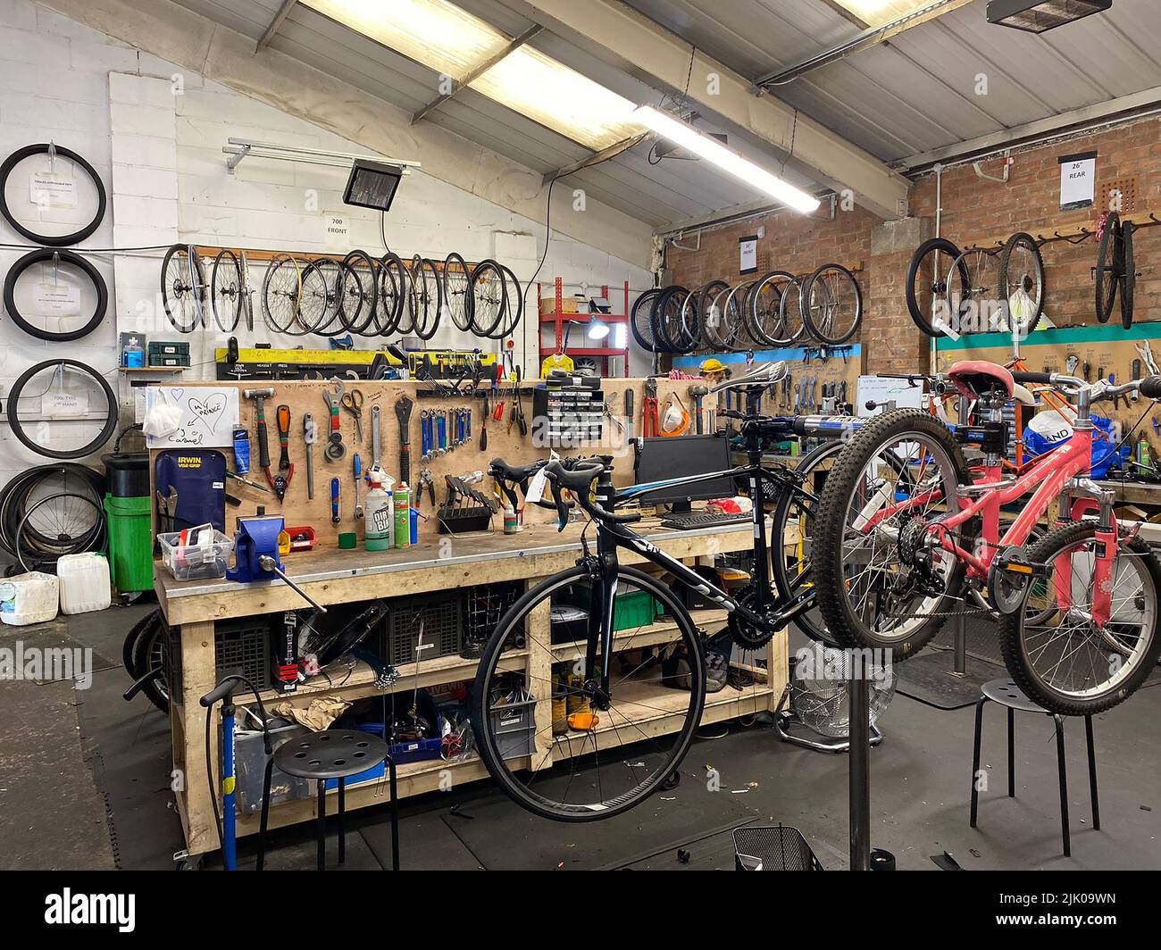 The Bike Project's workshop in Deptford. A charity which gives refurbished  second-hand bikes to refugees and asylum seekers Stock Photo - Alamy