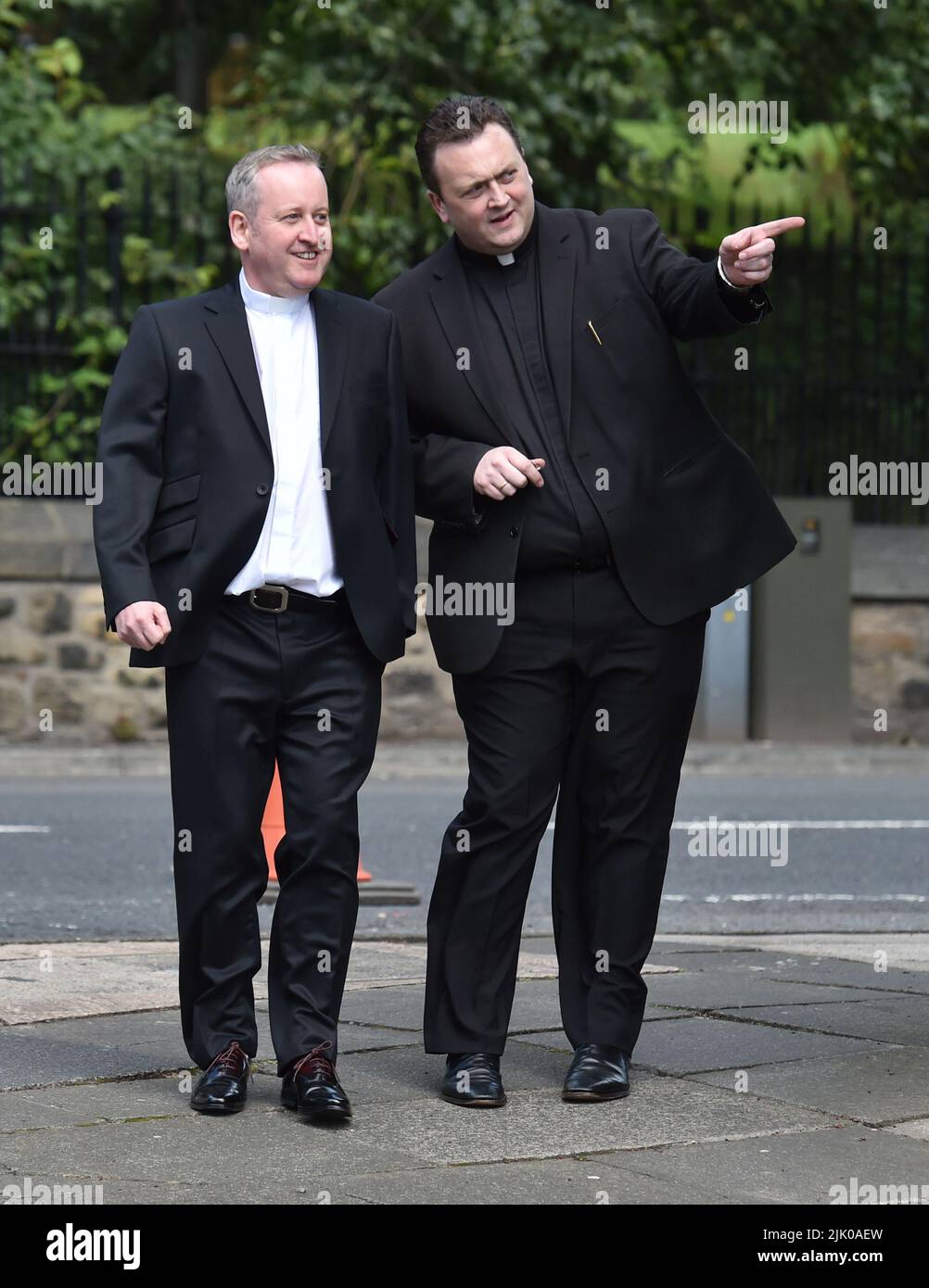 File photo dated 1/8/2015 of Father Dermott Donnelly (left) outside St Michael's Church, Elswick, Newcastle, ahead of the wedding of his brother Declan Donnelly and Ali Astall. A Requiem Mass will be held for the brother of TV star Dec. The popular priest, who had recently celebrated 30 years of service in the Catholic church, died earlier this month in hospital after falling seriously ill. The Requiem Mass was being held at St Mary's Cathedral, Newcastle, on Friday lunchtime. Issue date: Friday July 29, 2022. Stock Photo