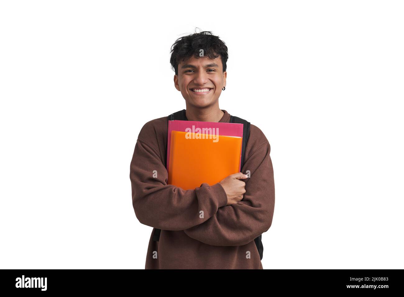 Young peruvian student smiling and holding folders and backpack, isolated. Stock Photo