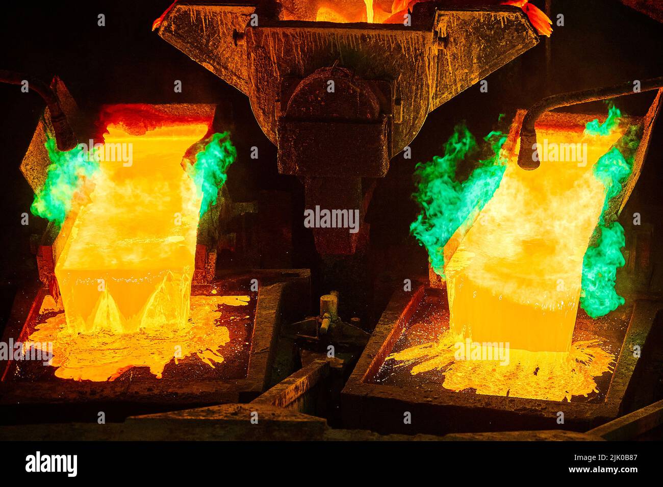 Pouring molten copper for anodes into form on casting wheel Stock Photo ...