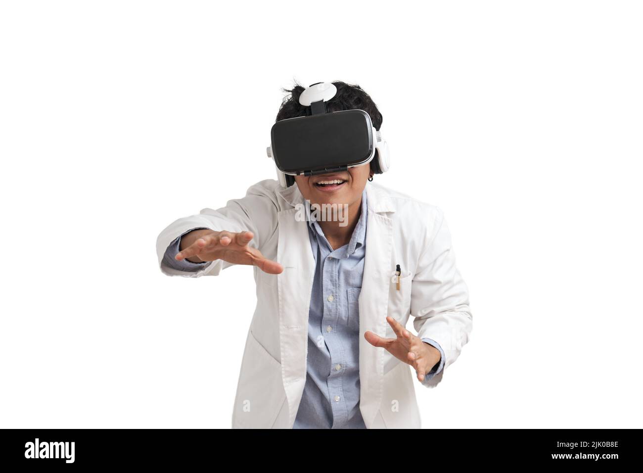 Young peruvian male scientific using virtual reality headset, isolated. Stock Photo