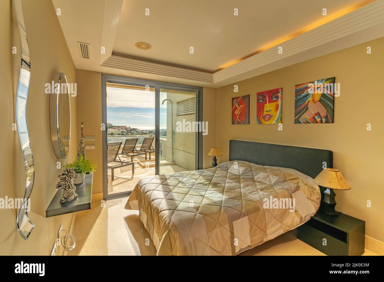 a view from inside one of the many rooms of a luxury apartment overlooking the Mediterranean coastline Stock Photo