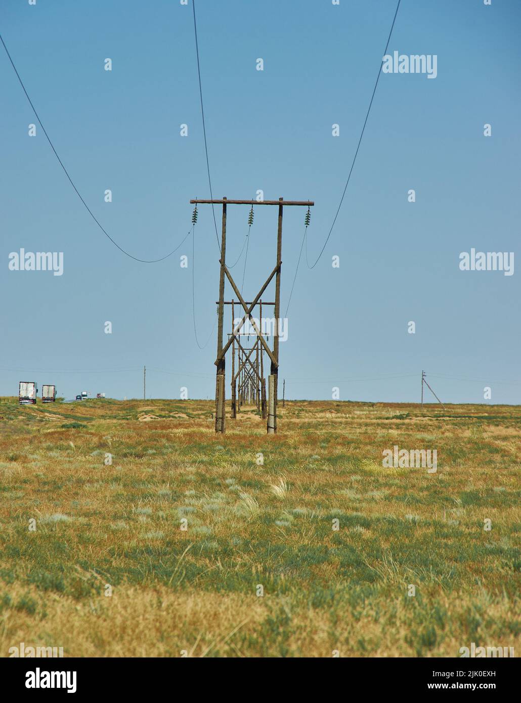 Overhead electric line in desert Republic of Kalmykia, Russia Stock Photo